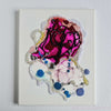 Close-up of "Pagliacci, 2020" artwork, featuring intricate embroidery, ink, and bead details on canvas.
