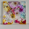 "Snow Jellies, 2022" embroidered artwork with alcohol ink, beads, and gold threads on canvas.