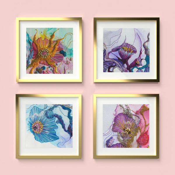 Four framed abstract floral textile art prints from the Viola Details series in gold frames on pink background