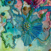 Close-up of colorful hand-stitched embroidery with beads and thread showing intricate textures and abstract floral design.
