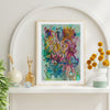Framed Viola Five 2022 Giclée fine art print with vibrant abstract floral textures on white shelf decor.