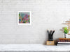 Viola Four 2022 Giclée fine art print showing detailed colorful embroidery textures in a white frame on white brick wall.