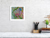 Framed Viola Four 2022 Giclée print showing colorful abstract embroidery details on a white brick wall.