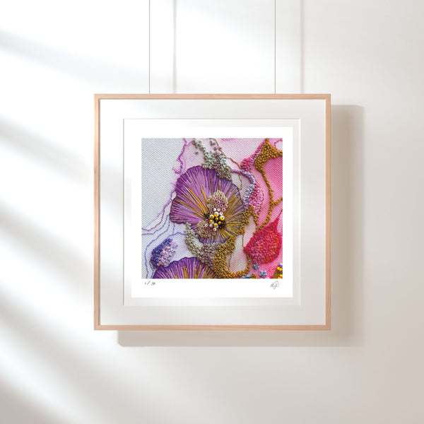 Framed Giclée print of Viola Odorata embroidery detail with purple, pink, and gold textured threads on white background.