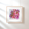 Framed Viola Odorata 2020 Giclée fine art print with abstract floral design in pink and purple tones on white wall.
