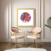 Viola Odorata 2020 Mojo Worlds fine art print with embroidered floral circle in gold frame above pink chairs