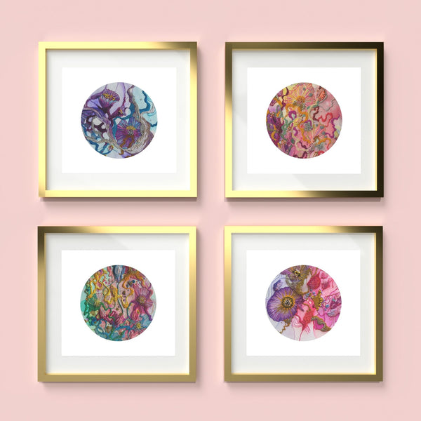 Four framed minimalist circular embroidery prints from the Viola Series by Manoela Grigorova on pink wall