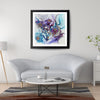 Framed Viola Seven 2023 Giclée print with abstract floral design in blue and purple, hanging above gray sofa.