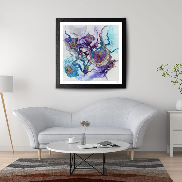 Framed Viola Seven 2023 Giclée print with abstract floral design in blue and purple, hanging above gray sofa.