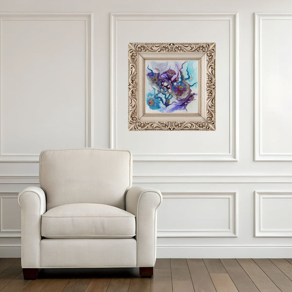 Ornate framed Viola Seven 2023 Giclée fine art print with abstract nature in blue and purple tones above beige armchair