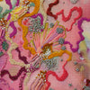 Close-up of hand-stitched Viola Six embroidery with colorful threads and beads in an abstract pattern on fabric