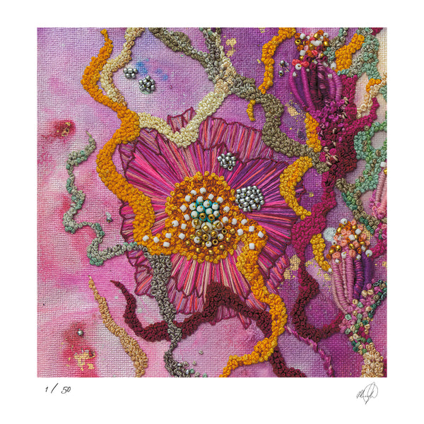 Close-up of vibrant hand-stitched embroidery with textured threads and beads in pink, orange, and purple tones.