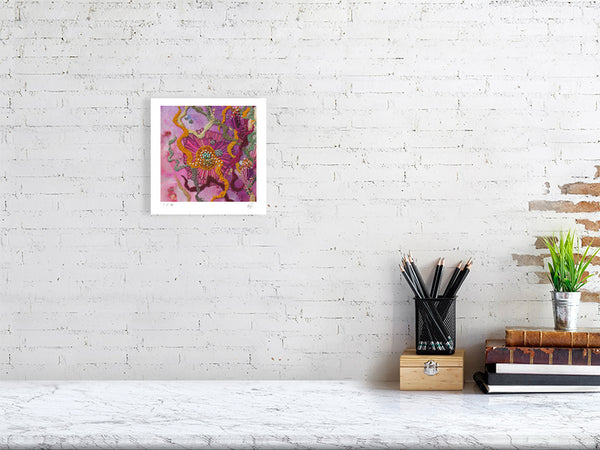 Viola Six 2022 Giclée fine art print showing colorful abstract embroidery detail on white brick wall above desk.