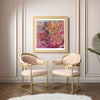 Viola Six 2022 abstract colorful giclée fine art print in gold frame displayed above two pink and gold chairs