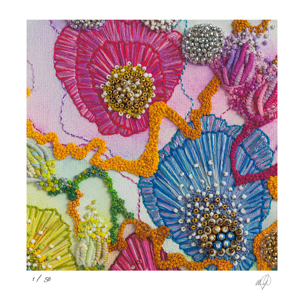 Close-up of colorful hand-stitched embroidery with beads, showcasing detailed texture and vibrant threads in an abstract floral pattern.