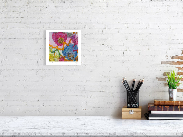 Framed Viola Three 2022 Giclée fine art print showing vibrant abstract embroidery details on white brick wall.