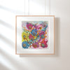 Framed Viola Three 2022 Giclée fine art print with abstract colorful floral and textured design on white wall.