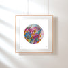 Framed Viola Three 2022 Mojo Worlds colorful circular embroidery fine art print on white wall.