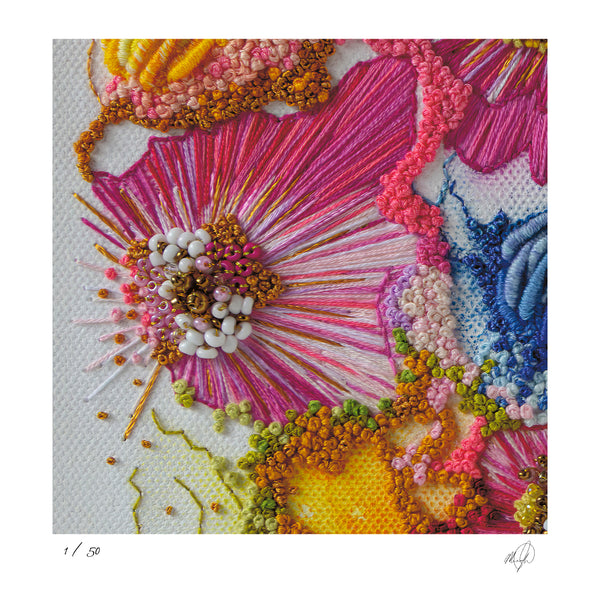 Close-up of vibrant embroidered threads and beads in pink, orange, and blue tones on textured fabric fine art print.