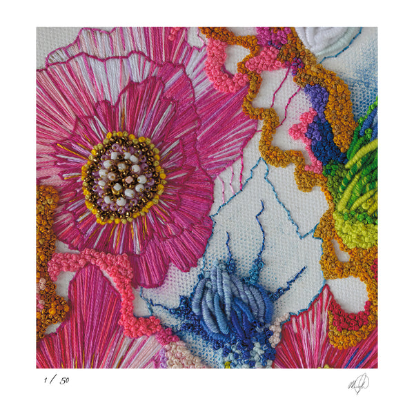 Close-up of colorful hand-stitched embroidery with intricate floral and abstract thread details in vivid hues.