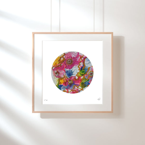 Framed modern giclée print featuring vibrant floral embroidery in a circular minimalist composition on white background.