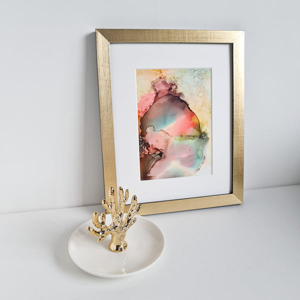 Abstract alcohol ink artwork titled Ares One depicting the Greek god of war, mounted in white with gold frame.