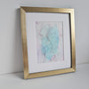 Abstract Birth of Aphrodite artwork in pastel blues and purples, alcohol ink on Yupo paper, mounted in white frame, gold frame not included.