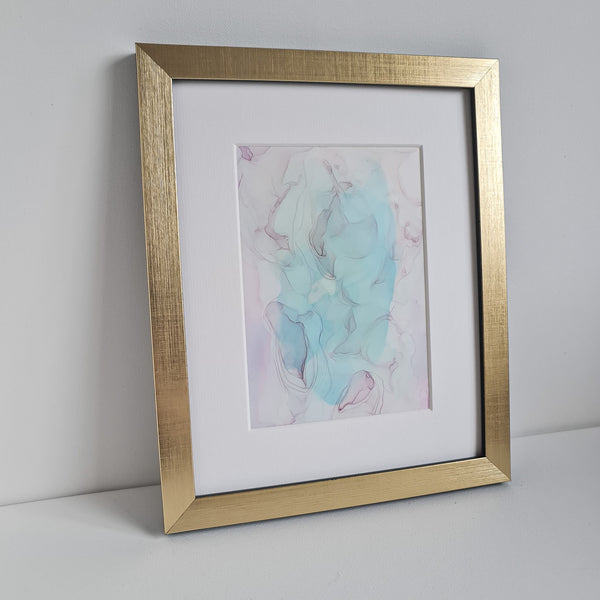 Abstract Birth of Aphrodite artwork in pastel blues and purples, alcohol ink on Yupo paper, mounted in white frame, gold frame not included.