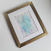 Abstract Birth of Aphrodite artwork in pastel blues and purples, alcohol ink on Yupo paper, mounted in white with gold frame.