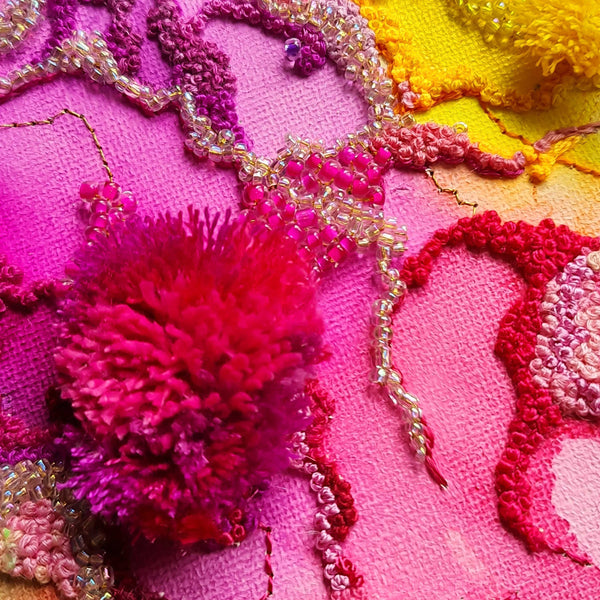 Close-up of Bloom & Burst Two artwork showing detailed hand embroidery, beads, and vibrant alcohol ink on canvas.