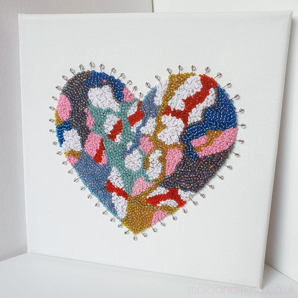 Embroidered heart artwork with metallic thread and beads on canvas, vibrant colors, ready to hang 20x20cm.