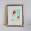 Abstract alcohol ink artwork Chloris One 2018 with soft red and blue floral shapes on light green background in gold frame