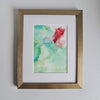 Abstract alcohol ink artwork titled Chloris Two, 2018, with soft green and red hues on Yupo paper in a gold frame.