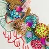 Close-up of Coral Wreath Nine 2022 featuring colorful beads, sequins, embroidery, and textured floral elements on canvas.