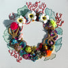 Coral Wreath Nine featuring vibrant beads, embroidery, faux flowers, and gold thread on a 40cm square canvas.