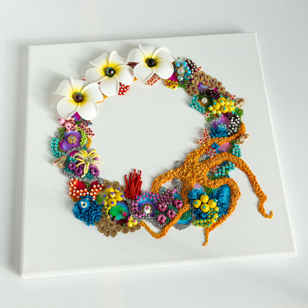 Abstract coral reef-inspired wreath with beads, embroidery, faux flowers, and metallic threads on white canvas.