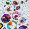 Close-up of Diffracta Two 2021 artwork with colorful upcycled beads, sequins, and embroidery on canvas.
