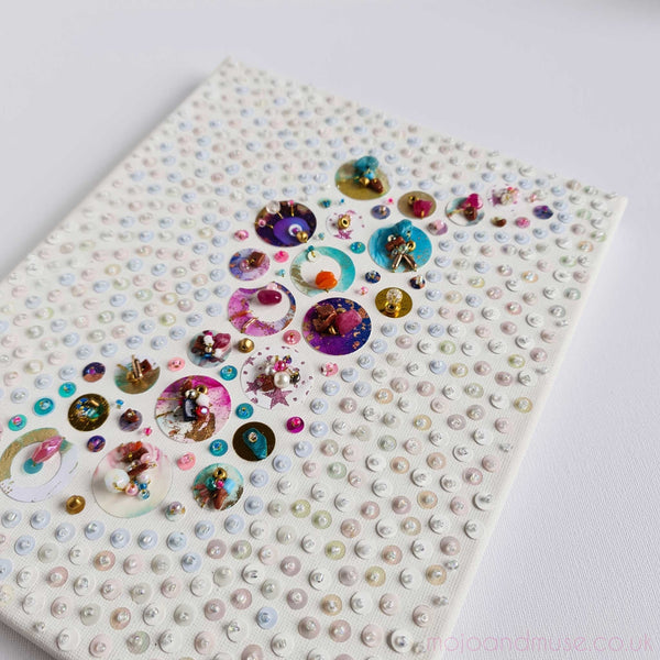 Handcrafted canvas artwork featuring upcycled beads, sequins, and embroidery in vibrant colors, 25x20cm size.