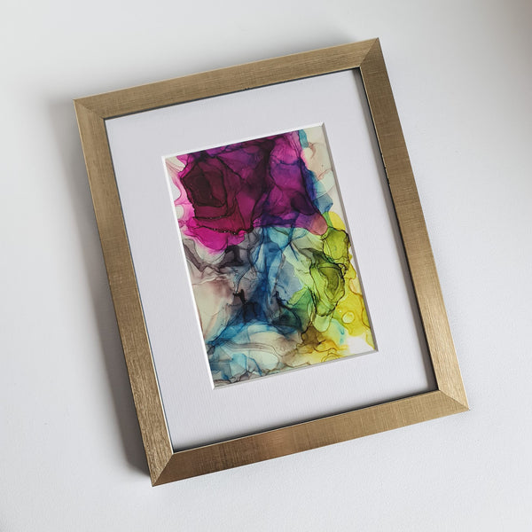 Abstract alcohol ink artwork titled Hera 2018, featuring vibrant purple, blue, and yellow hues, mounted ready for framing.