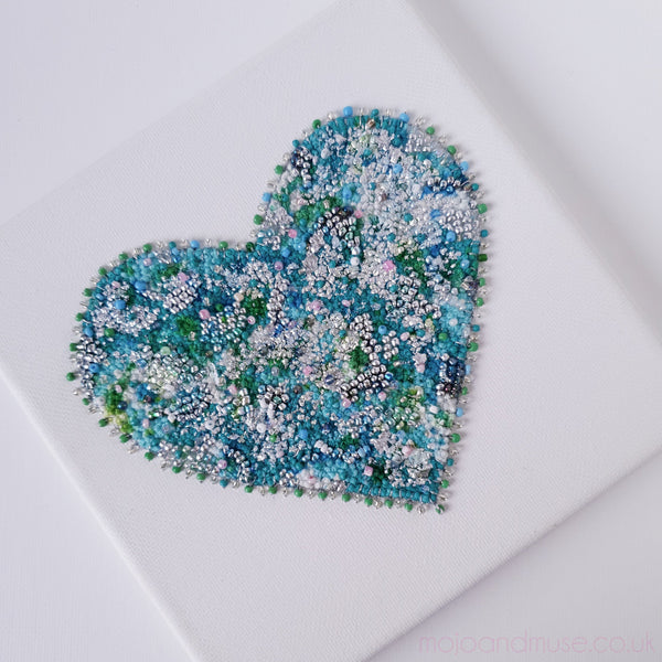 Embroidery thread, beads, alcohol ink, and gold leaf heart artwork on canvas, 15cm square, ready to hang.