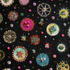 Close-up of intricate hand-embroidered sea jewels with beads, sequins, and gold foil on black canvas artwork.