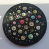 Circular mixed media artwork depicting colorful sea jewels and diatoms on a black canvas, 30cm diameter, ready to hang.