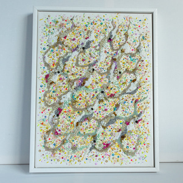 Hand-embroidered artwork with beads and confetti on canvas inspired by colorful, sparkling sea beds and microscopic sand life.