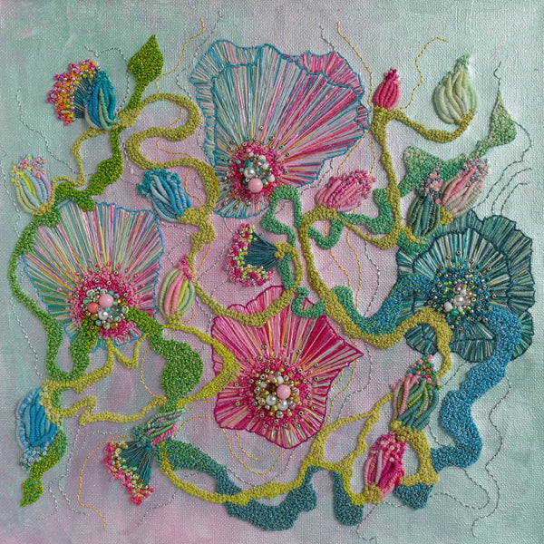 Abstract floral embroidery with pink, blue, and green threads, seed beads, and metallic accents on canvas.