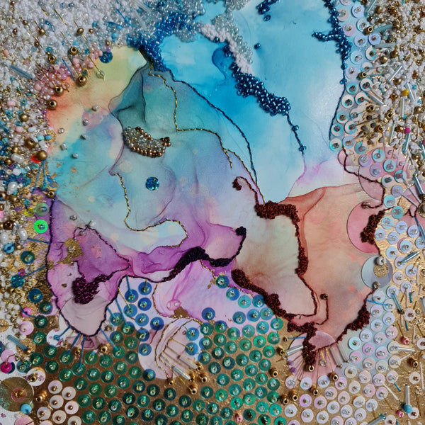 Abstract alcohol ink art with hand-embroidered beads, gold threads, and sequins on canvas, colorful and textured design.