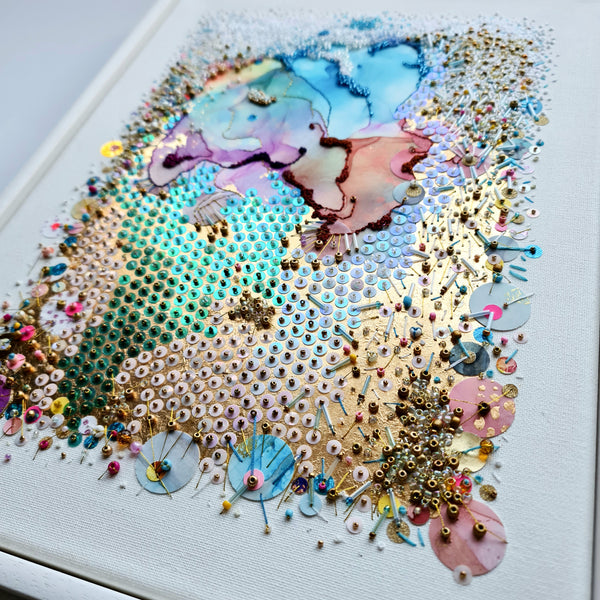 Abstract alcohol ink art with intricate hand embroidery, beads, and gold threads on canvas, 2023 artwork detail.